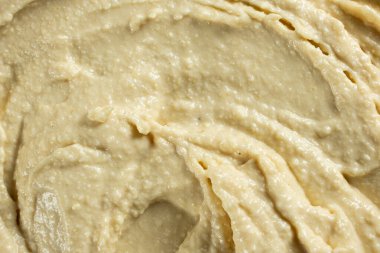 Yumuşak kremalı humus üst görünümünün makro dokusu.