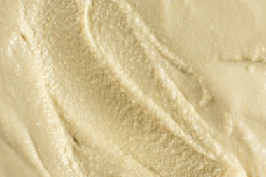 Yumuşak kremalı humus üst görünümünün makro dokusu.
