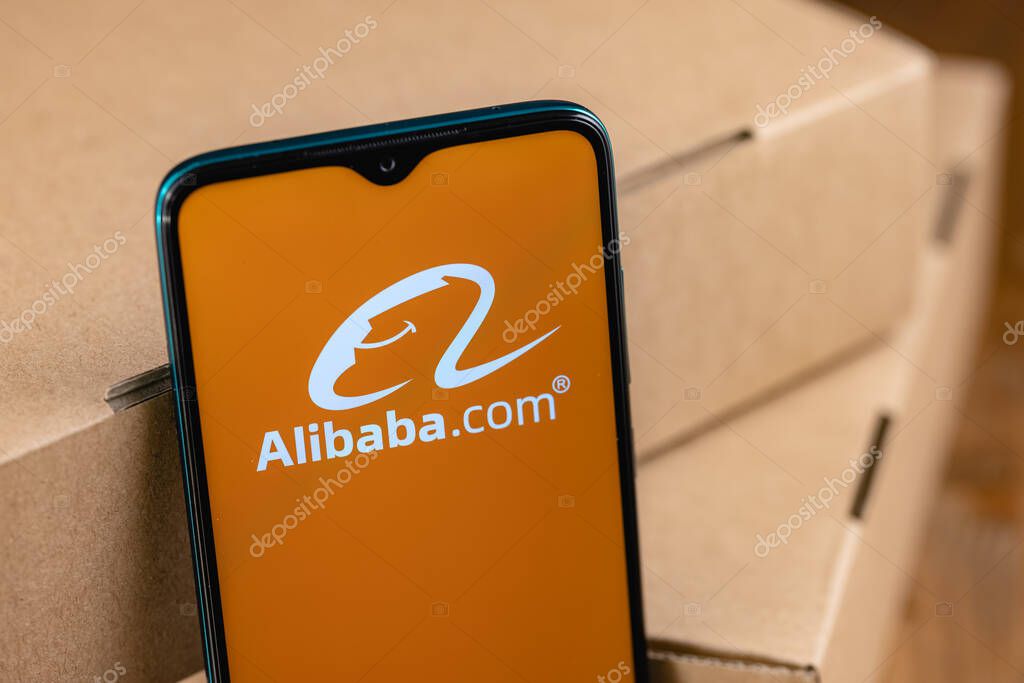Alibaba logo on the screen smartphone. Alibaba Group Holding Limited is a Chinese multinational technology company specializing in e-commerce, retail, Internet.
