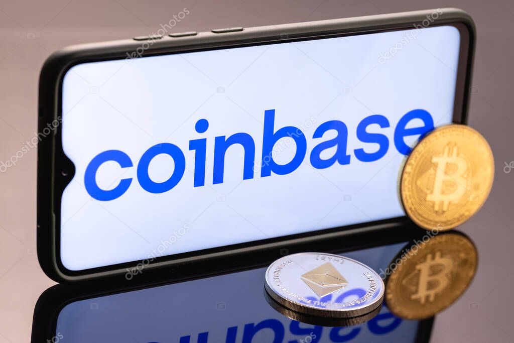 Kazan, Russia - May 16, 2021: Coinbase, is an American company that operates a cryptocurrency exchange platform. Ethereum coin and Bitcoin on the background of the coinbase inscription.