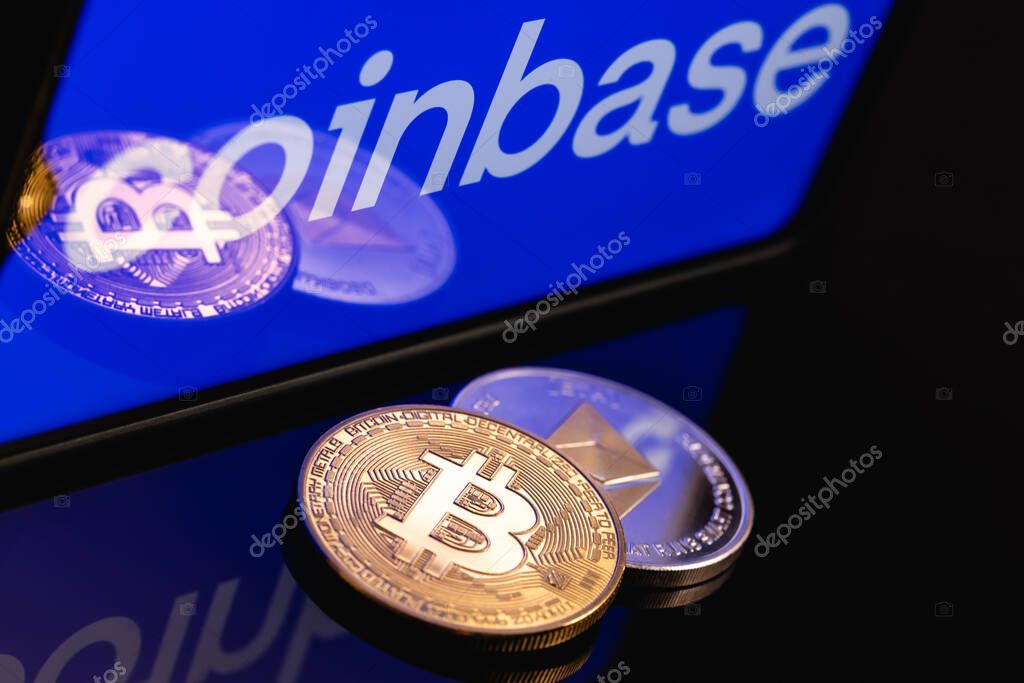 Kazan, Russia - May 16, 2021: Coinbase, is an American company that operates a cryptocurrency exchange platform. Ethereum coin and Bitcoin on the background of the coinbase inscription.