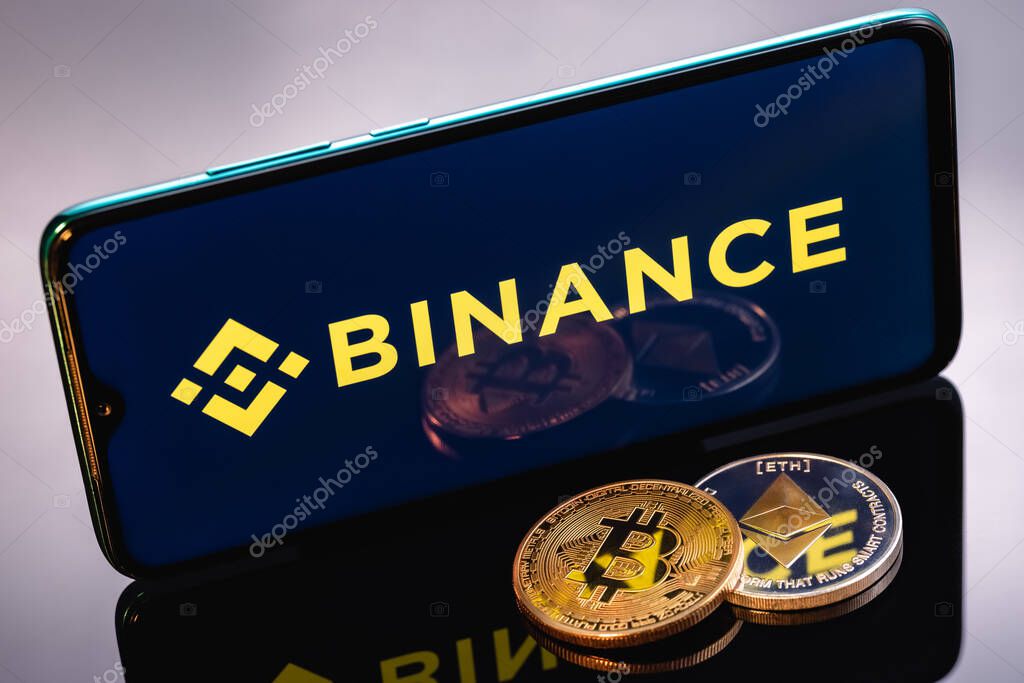 Kazan, Russia - May 17, 2021: Binance is cryptocurrency exchange that provides a platform for trading various cryptocurrencies. Ethereum coin and Bitcoin on the background of the BINANCE inscription.