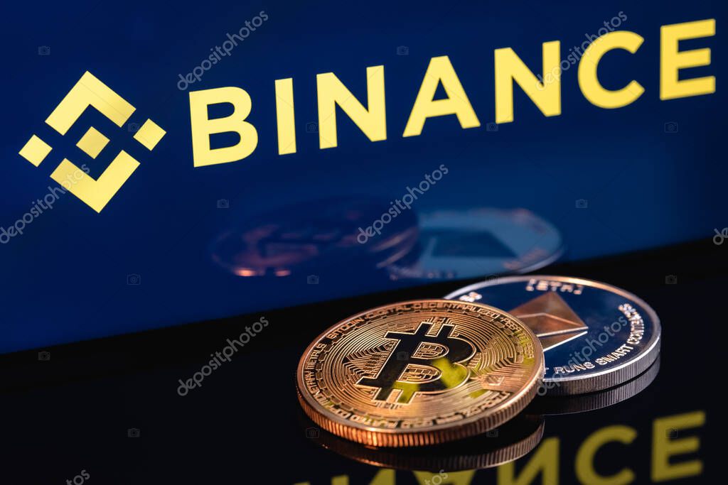 Kazan, Russia - May 17, 2021: Binance is cryptocurrency exchange that provides a platform for trading various cryptocurrencies. Ethereum coin and Bitcoin on the background of the BINANCE inscription.