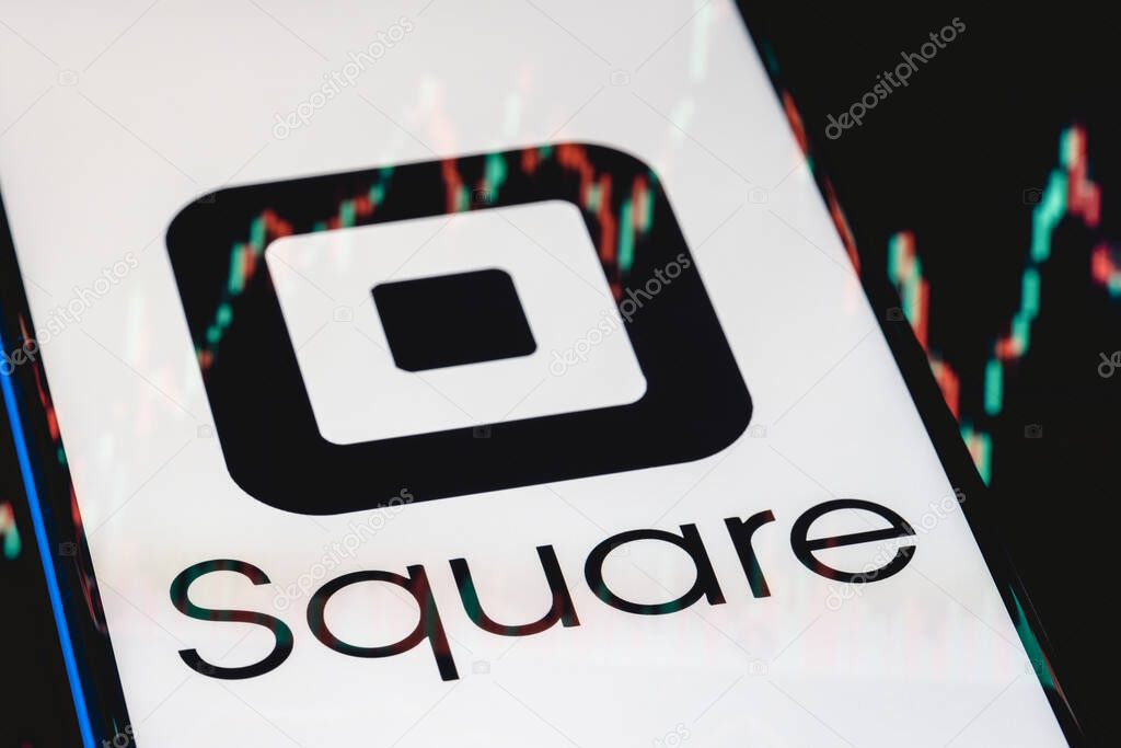 Kazan, Russia - May 30, 2021: Square is technology company that develops solutions for accepting and processing electronic payments. Square logo on smartphone screen. Stock chart in the reflection.