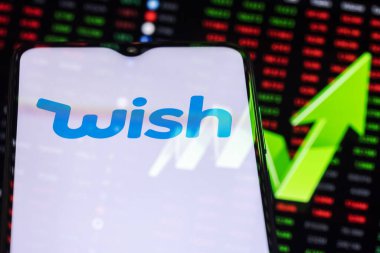 Kazan, Russia - June 09, 2021: Wish is online e-commerce platform that facilitates transactions between sellers and buyers. Wish logo on the background of a large green arrow pointing up. clipart