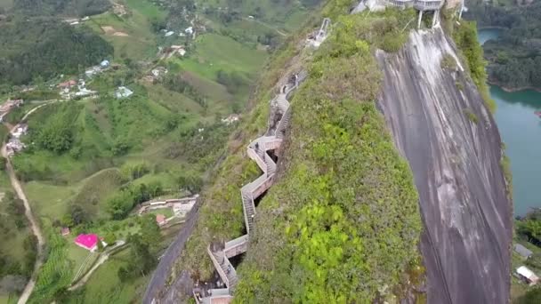 Aerial view of the stairs of Peck de Guatape, a large granite rock, Colombia — Stock video