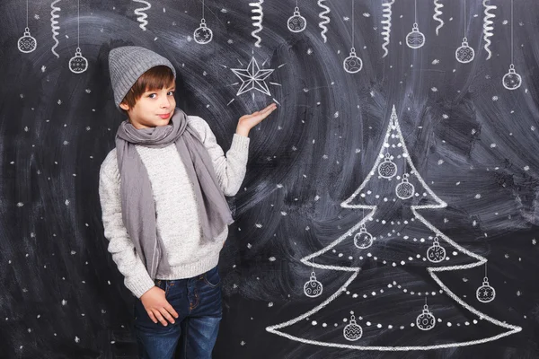 Boy holding snowflake — Stock Photo, Image