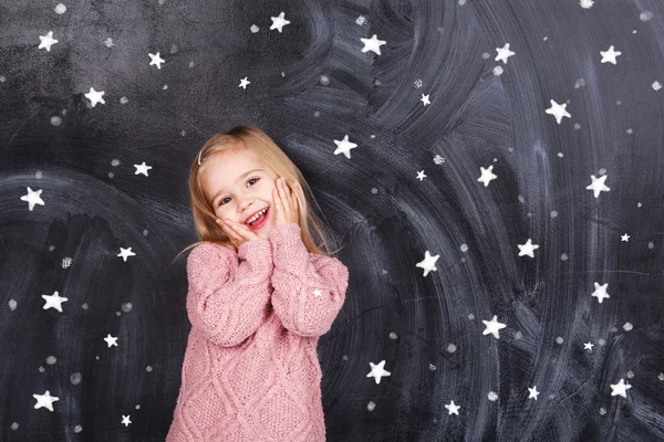 The girl on the background of stars — Stock Photo, Image