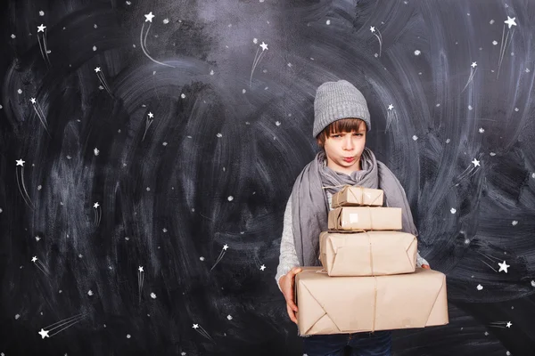 Angry boy and gifts — Stock Photo, Image