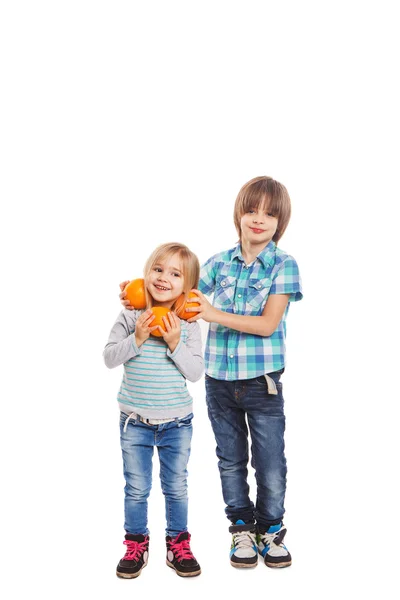 Oranges in hands of children — Stock Photo, Image