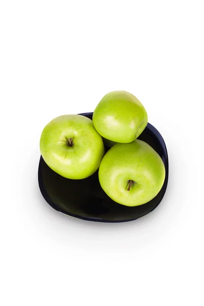 Apples on a black plate — Stock Photo, Image