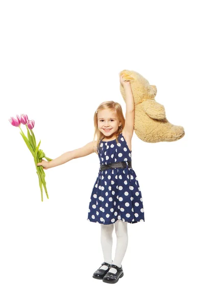 Flores de niña y un oso de peluche —  Fotos de Stock