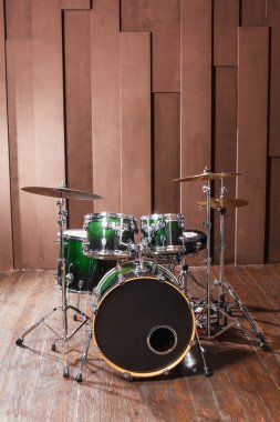Drums on wooden background clipart