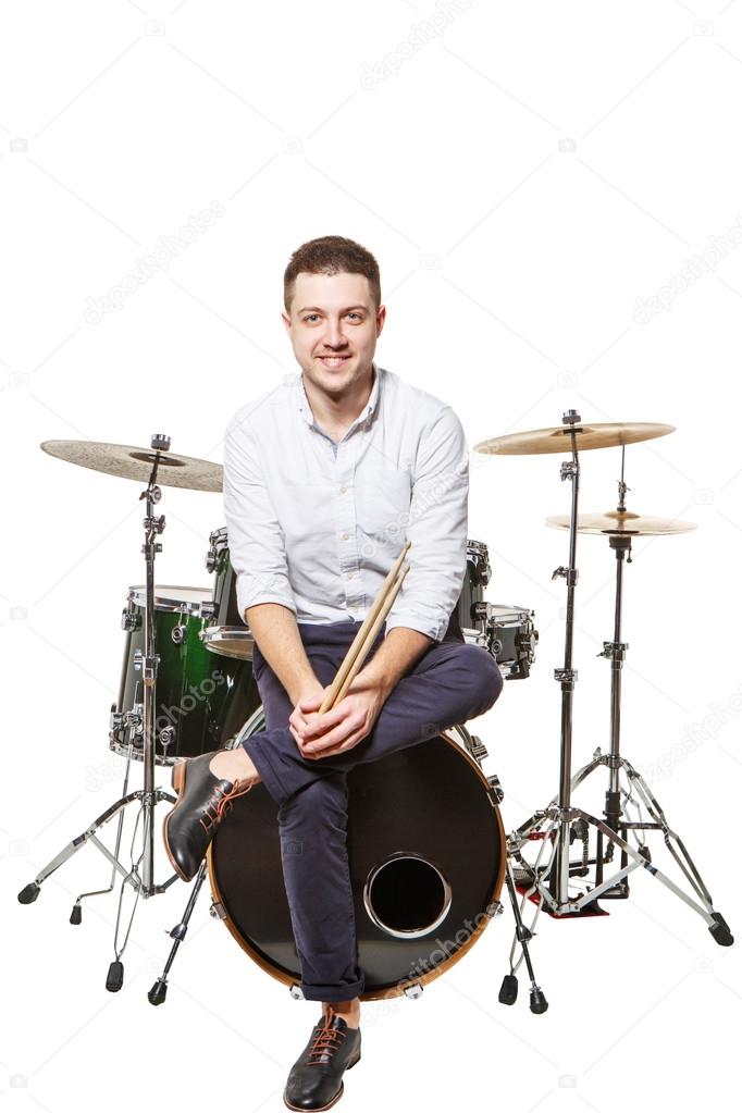 Man sits on drums
