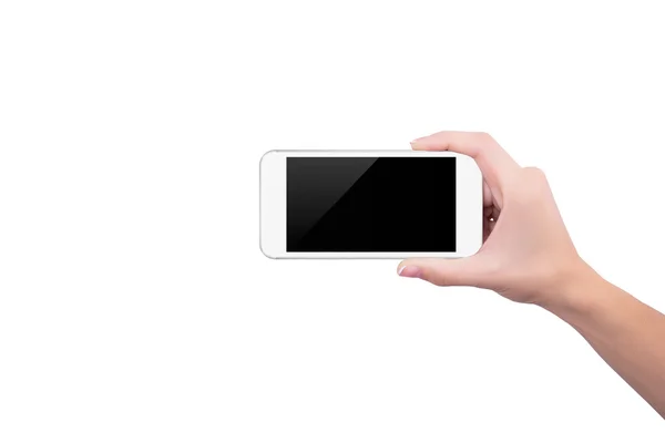 Chica sosteniendo el teléfono blanco en posición vertical en su mano derecha — Foto de Stock