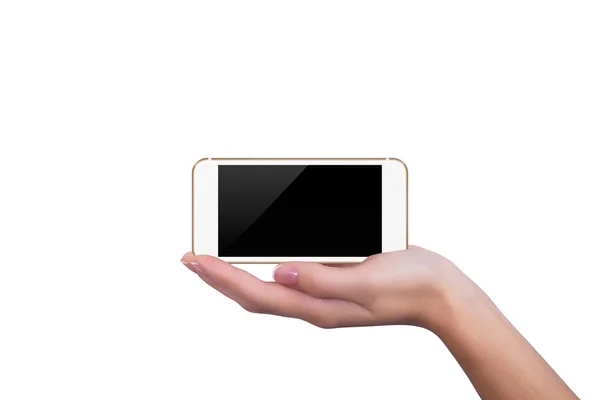 Золотий телефон лежить на руці дівчини — стокове фото