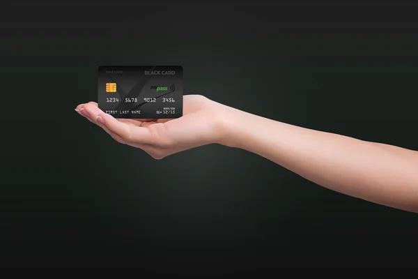 Black credit card on dark background — Stock Photo, Image