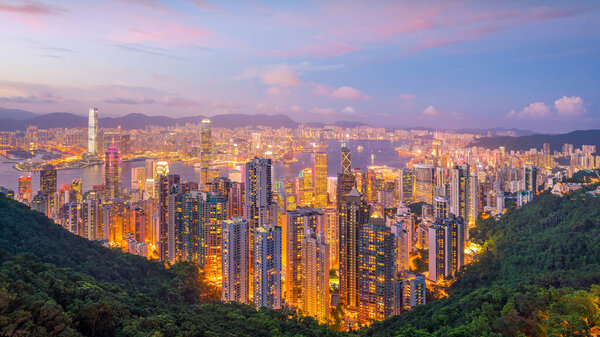 Panoramic view of Victoria Harbor and Hong Kong skyline in China at sunset