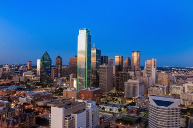 Dallas, Texas cityscape with blue sky at sunset clipart
