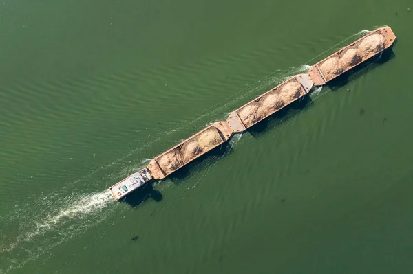 barge transporting commodities in river - Tiete Waterway.