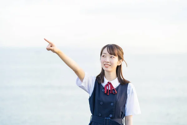 Asian Female High School Student Pointing Sky — Stock Photo, Image