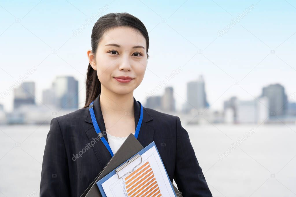 Asian young business woman and tokyo city scape in fine day