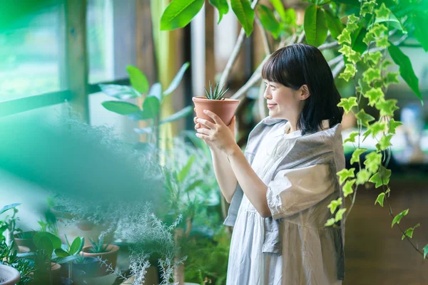 Young Woman Looking Foliage Plants Smile — Stock Photo, Image