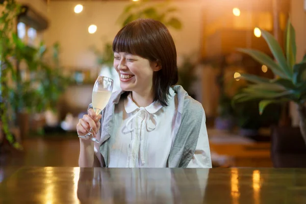 Young Woman Holding Glass Champagne Warm Atmosphere — Stock Photo, Image