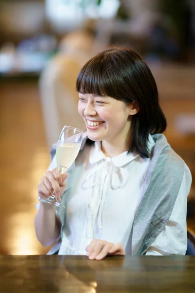 Young Woman Holding Glass Champagne Warm Atmosphere — Stock Photo, Image