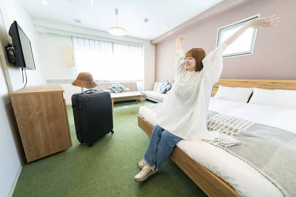 Asian Woman Relaxing Simple Hotel Room — Stock Photo, Image