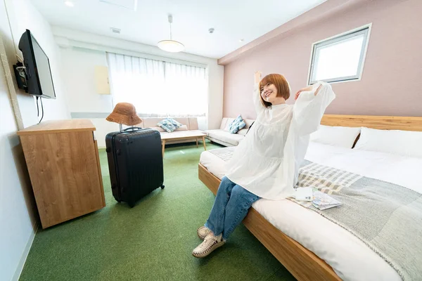 Asian Woman Relaxing Simple Hotel Room — Stock Photo, Image