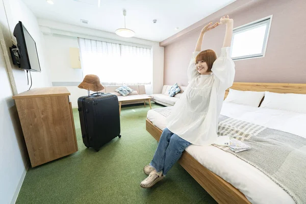 Asian Woman Relaxing Simple Hotel Room — Stock Photo, Image