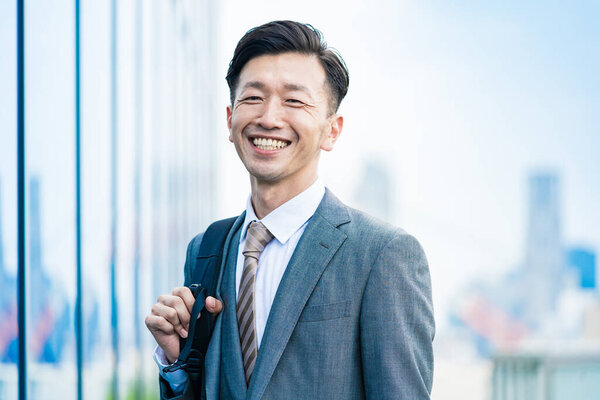 Asian businessman who commute with a smile
