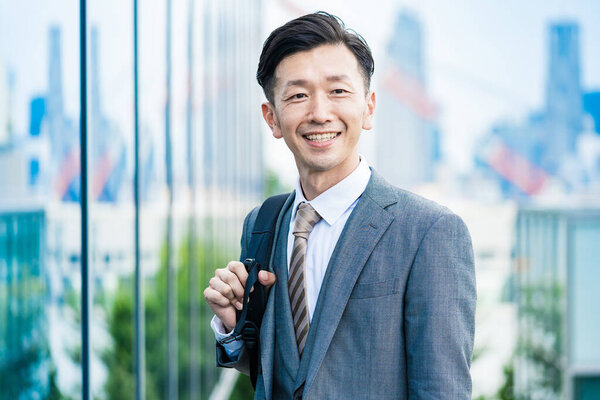 Asian businessman who commute with a smile
