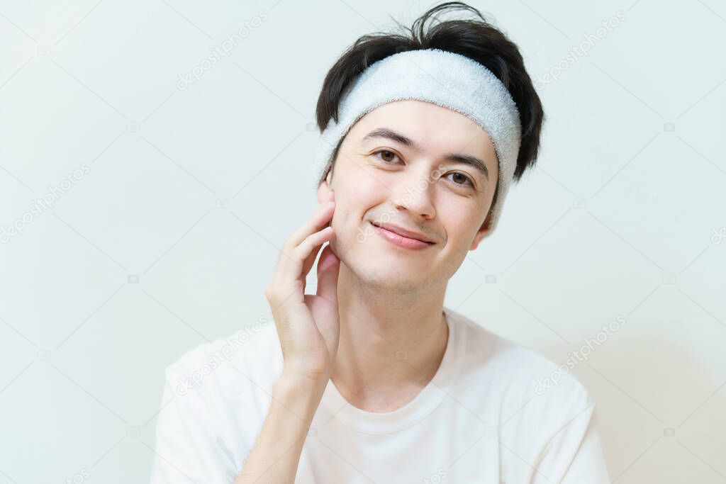 Asian young man checking skin condition