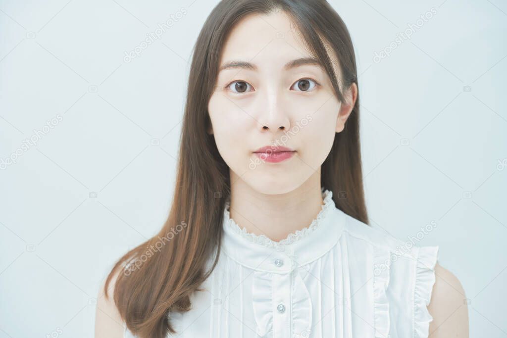 Portrait of a young Asian woman taken in flat lighting 