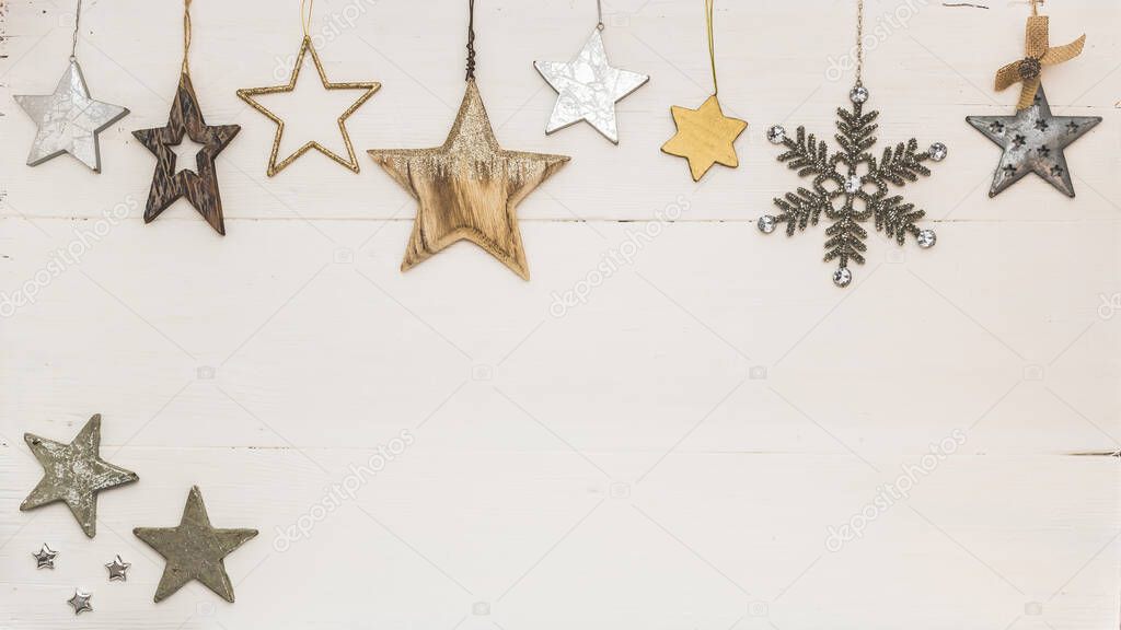 Christmas frame made of white, golden and silver christmas decorations on white background. Flat lay, top view, copy space