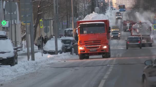 Orange city snow plows moving on city street at the winter — Stock Video