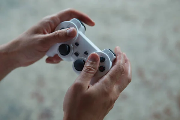 Close up of playing video games while holding a game controller. — Stock Photo, Image