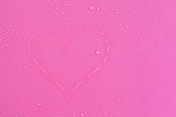 Full frame of the textures formed by the bubbles and drops of water. Drops of water spilled on a light pink surface