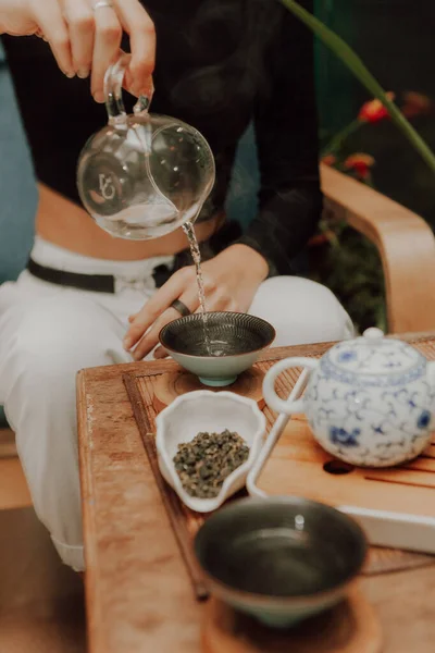 Woman serving Chinese tea in a tea ceremon