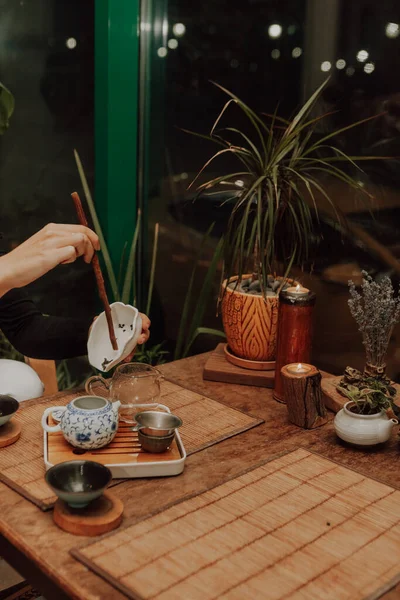 Woman serving Chinese tea in a tea ceremon