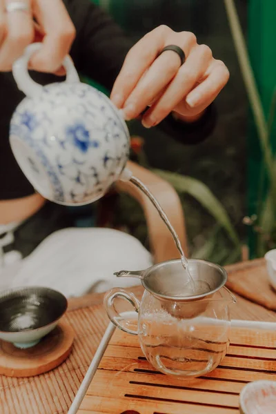 Woman serving Chinese tea in a tea ceremon