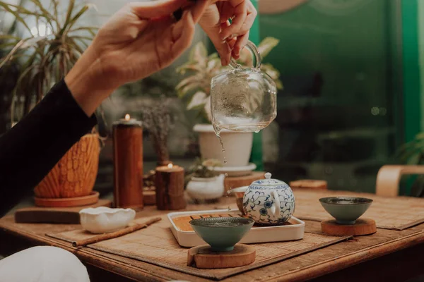 Woman serving Chinese tea in a tea ceremon