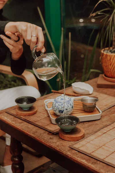 Woman serving Chinese tea in a tea ceremon