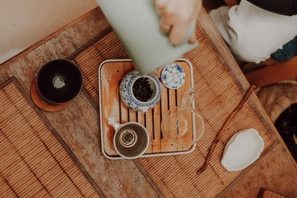 Woman serving Chinese tea in a tea ceremon