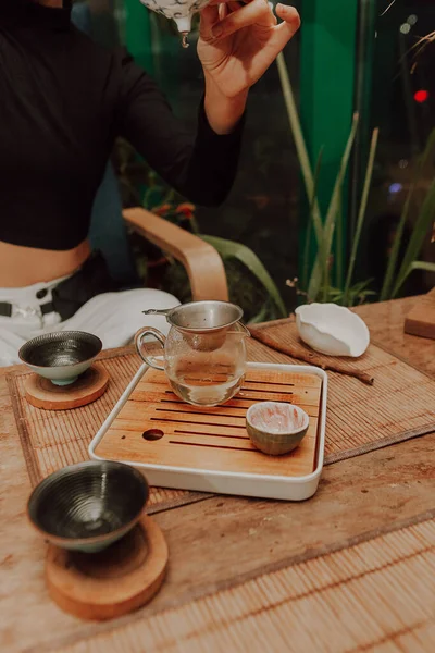 Woman serving Chinese tea in a tea ceremon