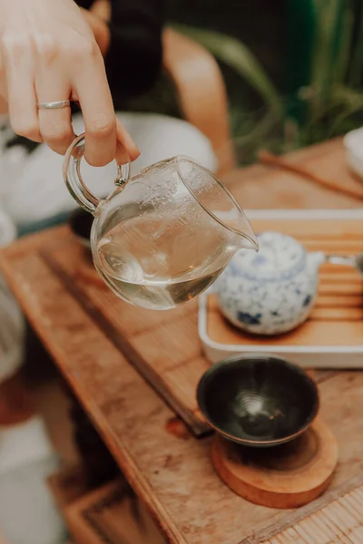 Woman serving Chinese tea in a tea ceremon