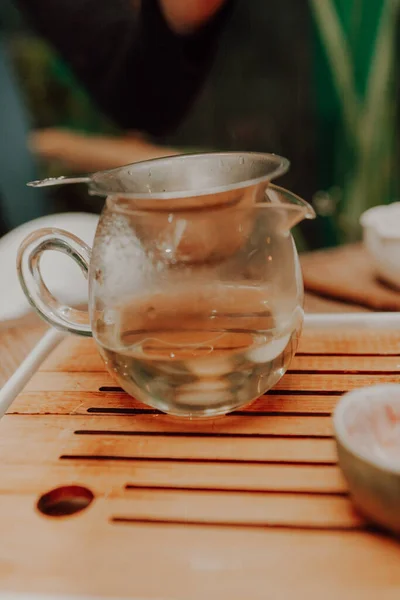 Woman serving Chinese tea in a tea ceremon