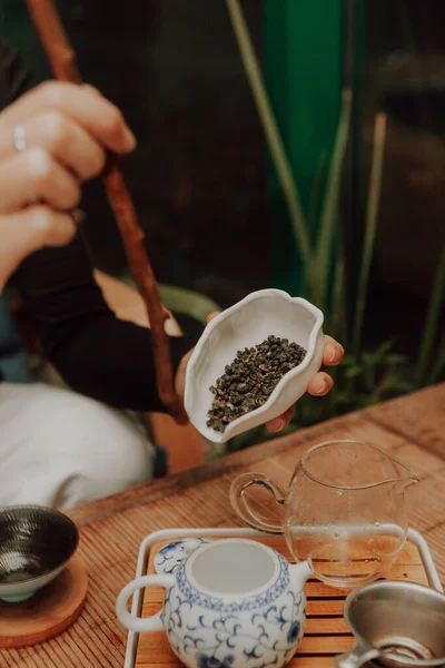 Woman serving Chinese tea in a tea ceremon